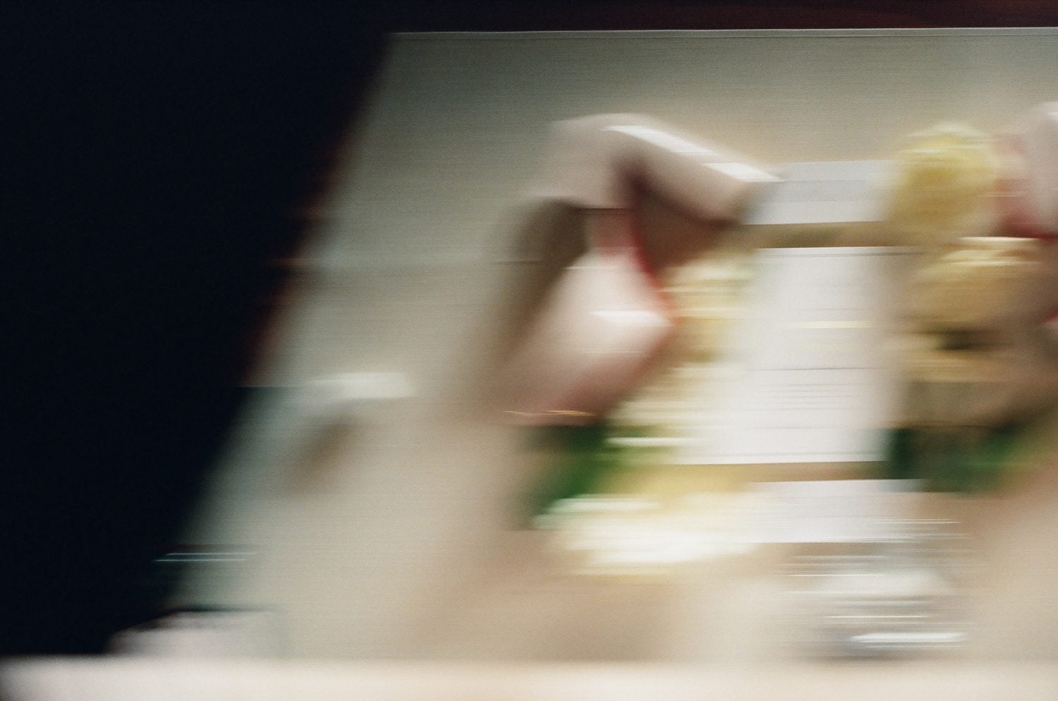 Motion blurred film photograph of a reading during the ceremony