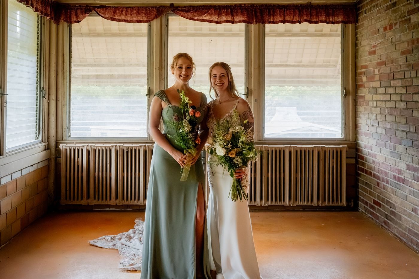 Bridesmaid caught in a candid moment beside a window