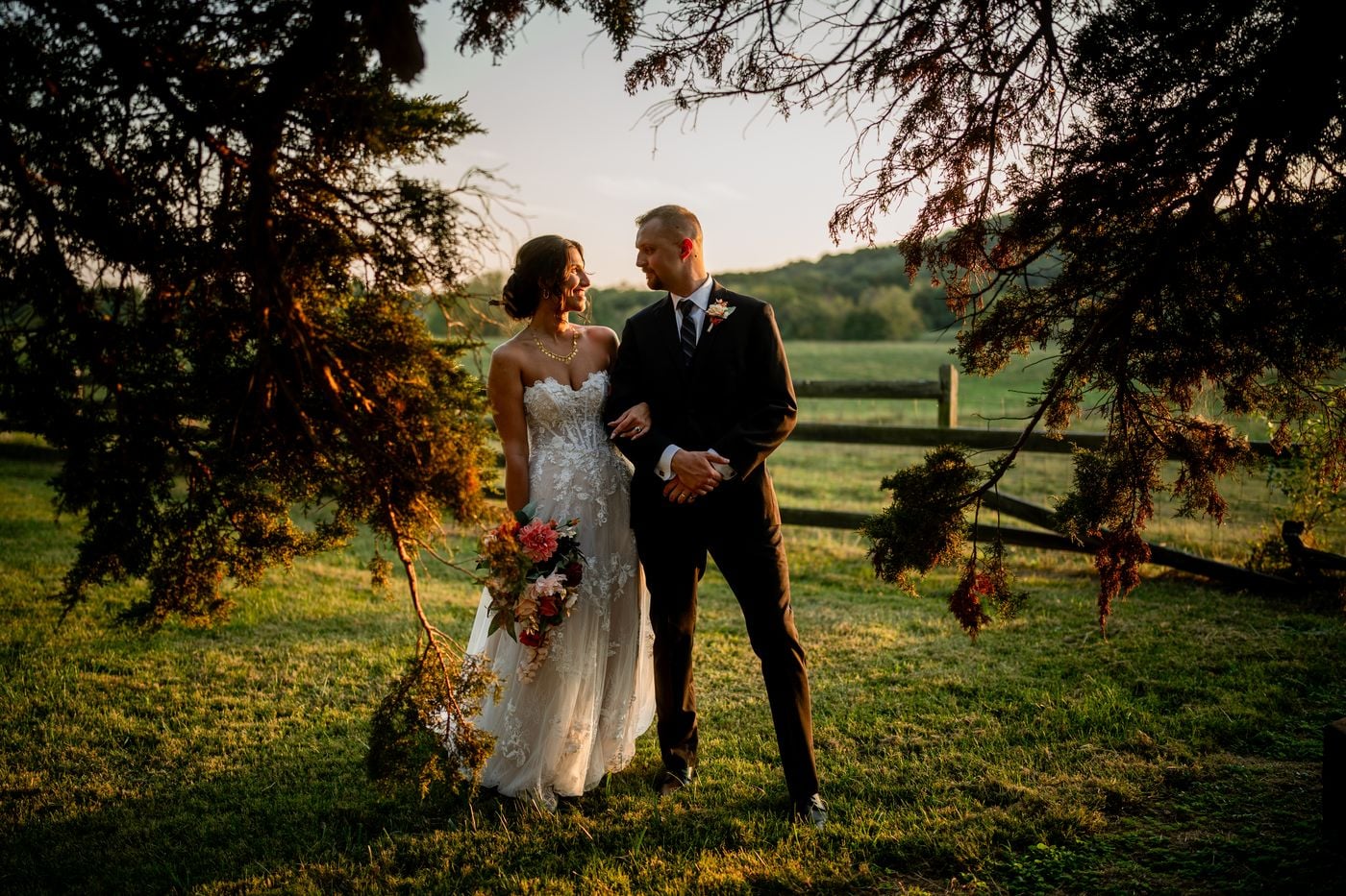 Couple portrait among evergreen trees