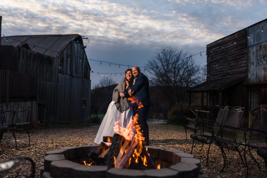 Wedding couple in front of a fire