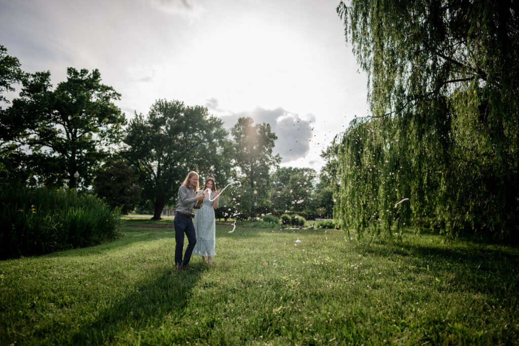 Tower Grove Park Engagement Session Champagne spray